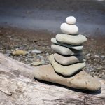 a stack of rocks on a wood surface